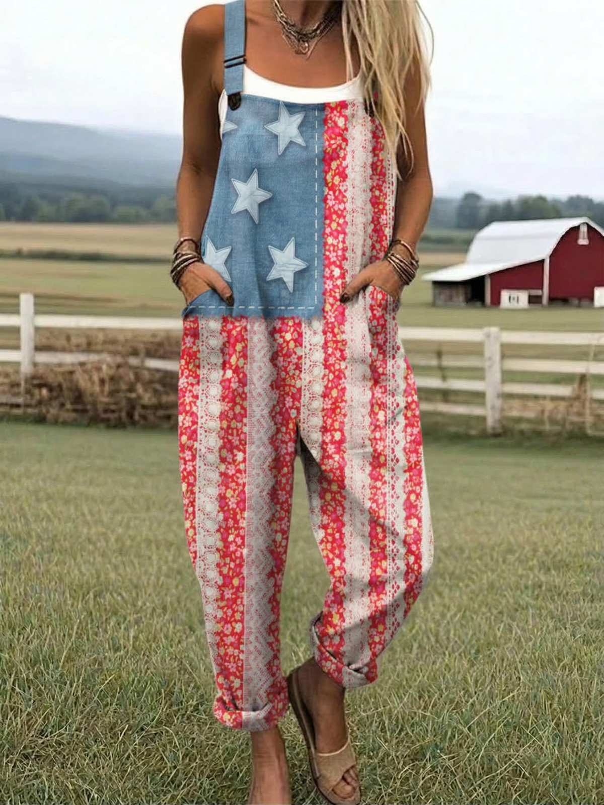 Sleeveless star-and-stripe jumpsuit with blue star panel and red patterned vertical stripes