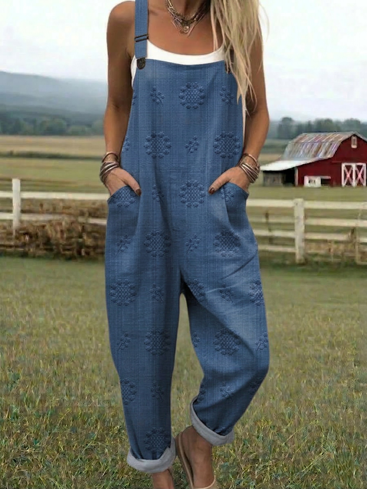 Blue relaxed jumpsuit with embroidered floral pattern, wide-leg bib overalls