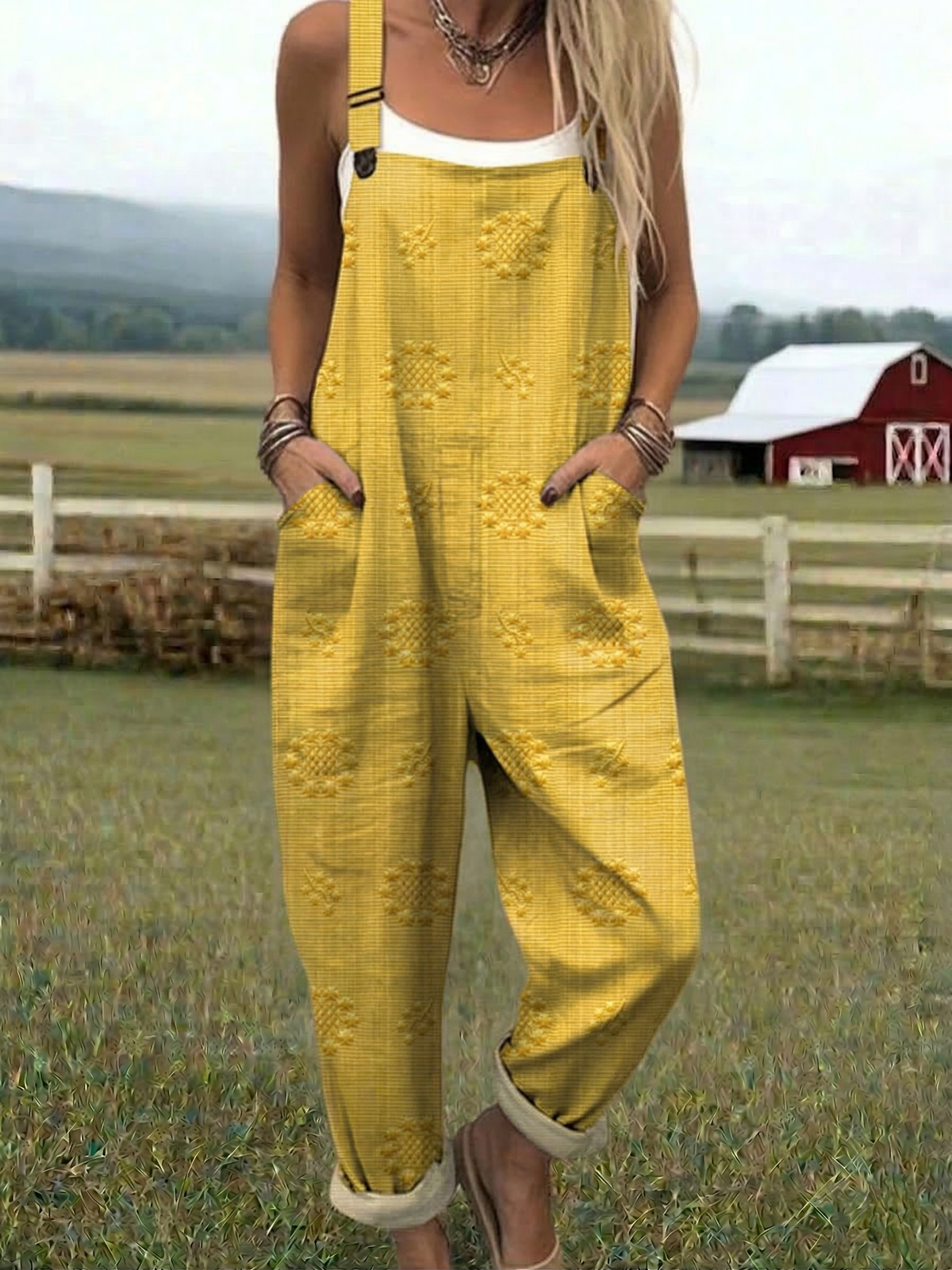 Yellow relaxed jumpsuit with embroidered floral pattern, wide-leg bib overalls