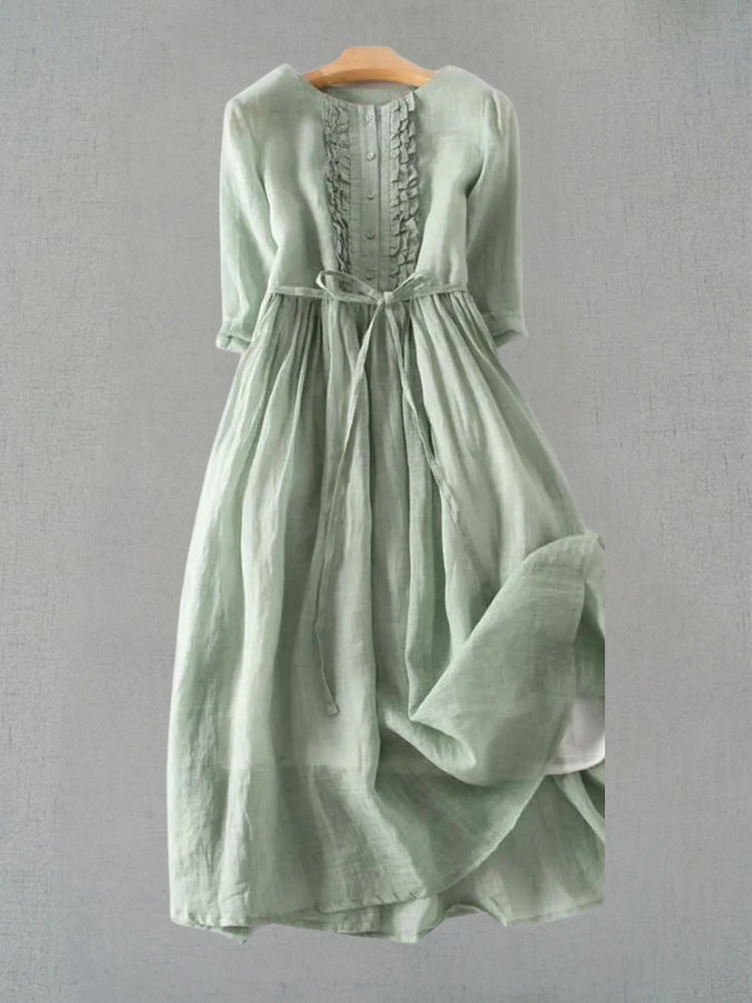 Women’s green lace-up waist dress with round neck and gathered skirt