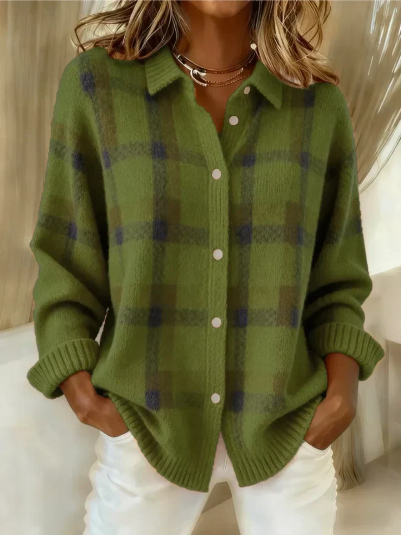Green and dark plaid button-up blouse with long sleeves and white front buttons