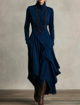 Blue asymmetrical maxi knit dress with roll neck and draped wrap front, long sleeves