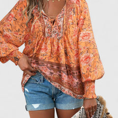 Orange floral peasant blouse with gathered neckline and long puff sleeves