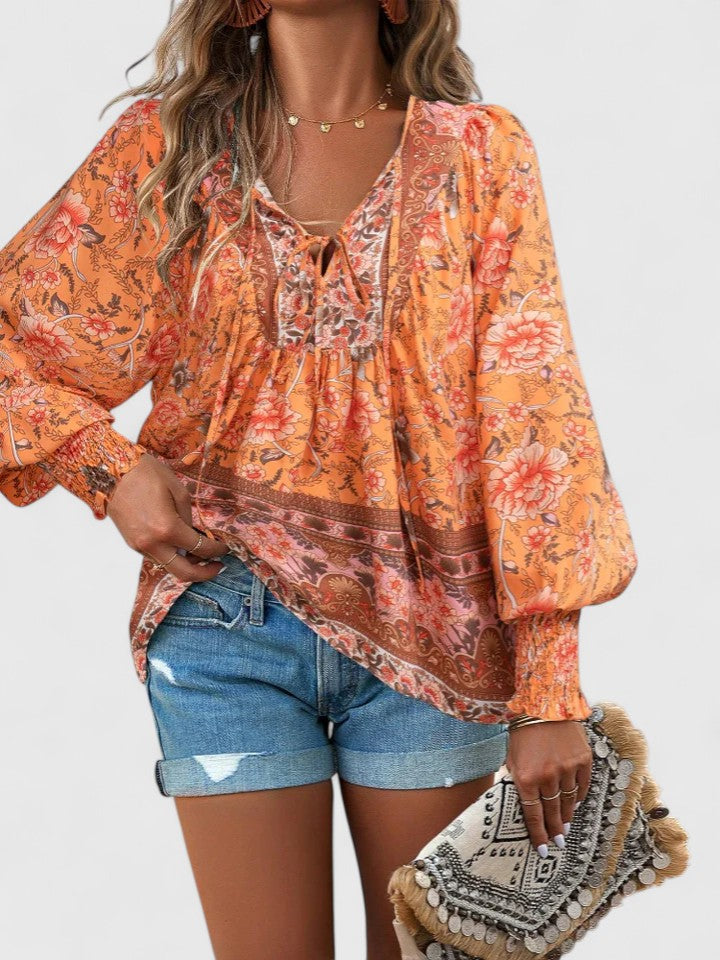 Orange floral peasant blouse with gathered neckline and long puff sleeves