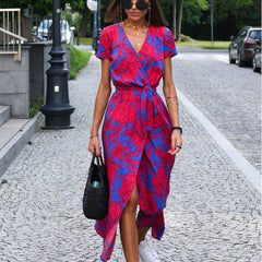 Blue and red floral wrap dress with short sleeves, V-neck, and waist tie