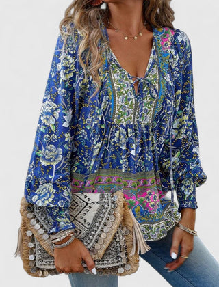Blue floral peasant blouse with gathered neckline and long sleeves with elastic cuffs