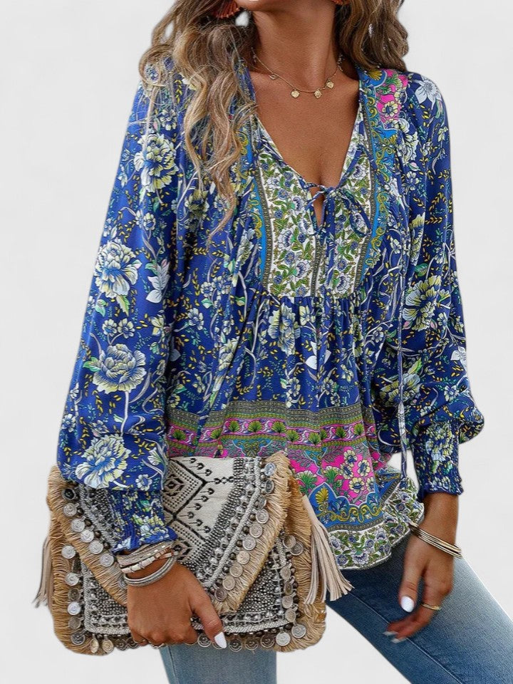 Blue floral peasant blouse with gathered neckline and long sleeves with elastic cuffs