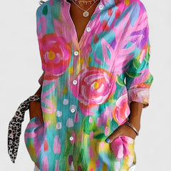 Colorful printed blouse with button-front, pointed collar, and long sleeves
