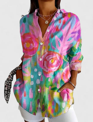 Colorful printed blouse with button-front, pointed collar, and long sleeves