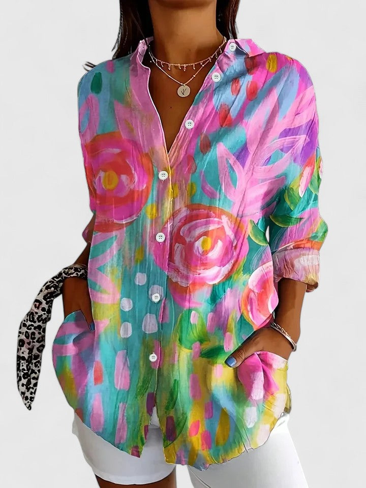 Colorful printed blouse with button-front, pointed collar, and long sleeves