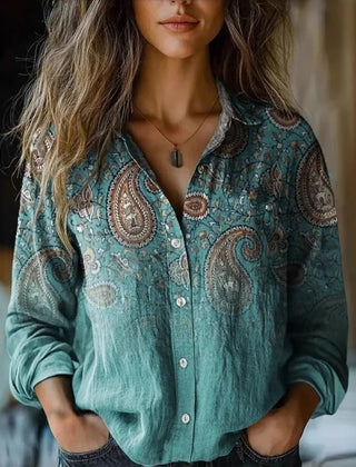 Teal paisley button-up blouse with long sleeves and front button placket