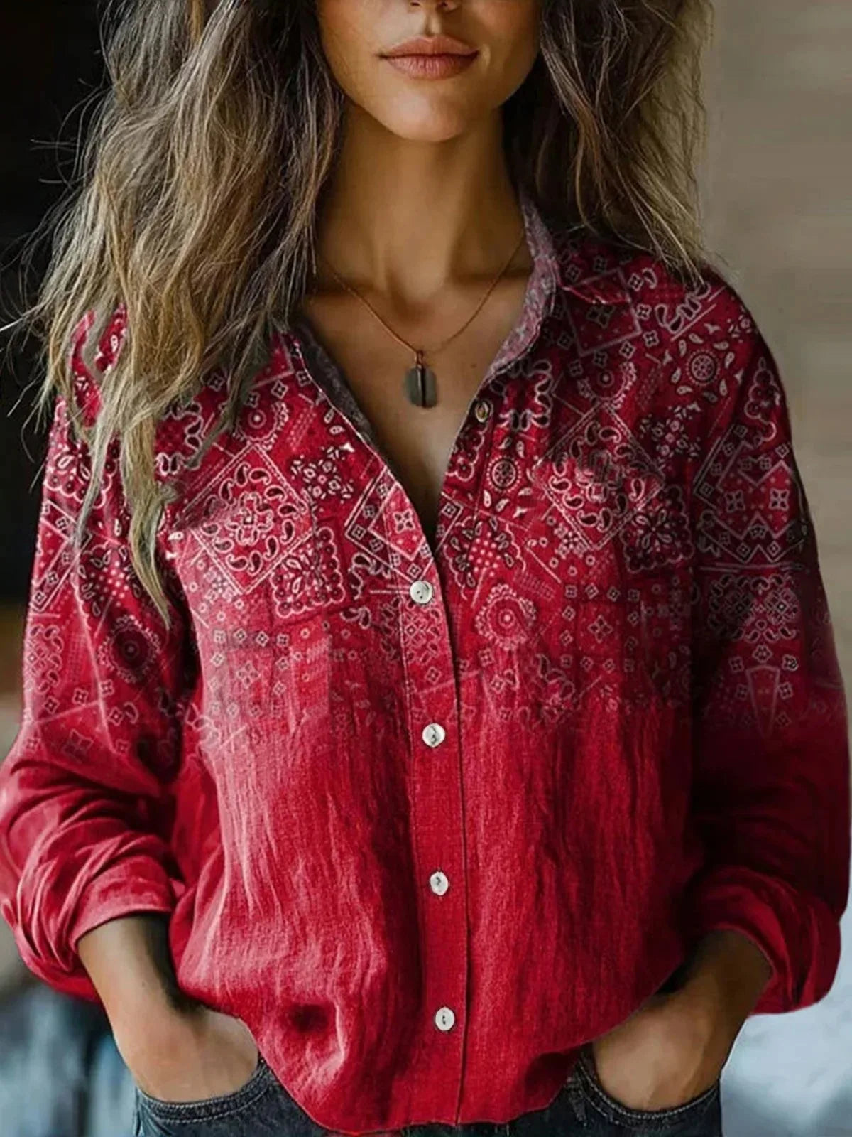 Deep red bandana pattern button-up blouse with long sleeves and collar