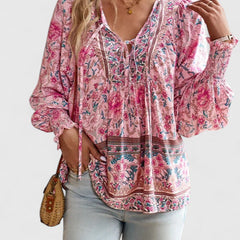 Pink floral peasant blouse with deep V neckline and billowy long sleeves