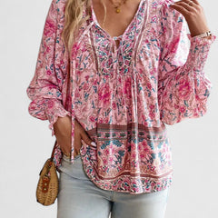 Pink floral peasant blouse with gathered V-neck and ruffled cuffs
