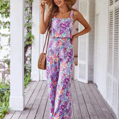 Floral wide-leg jumpsuit, sleeveless square neckline, purple-pink print, ruched bodice