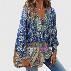 Blue floral peasant blouse with V-neck tie, tiered bodice, long puff sleeves