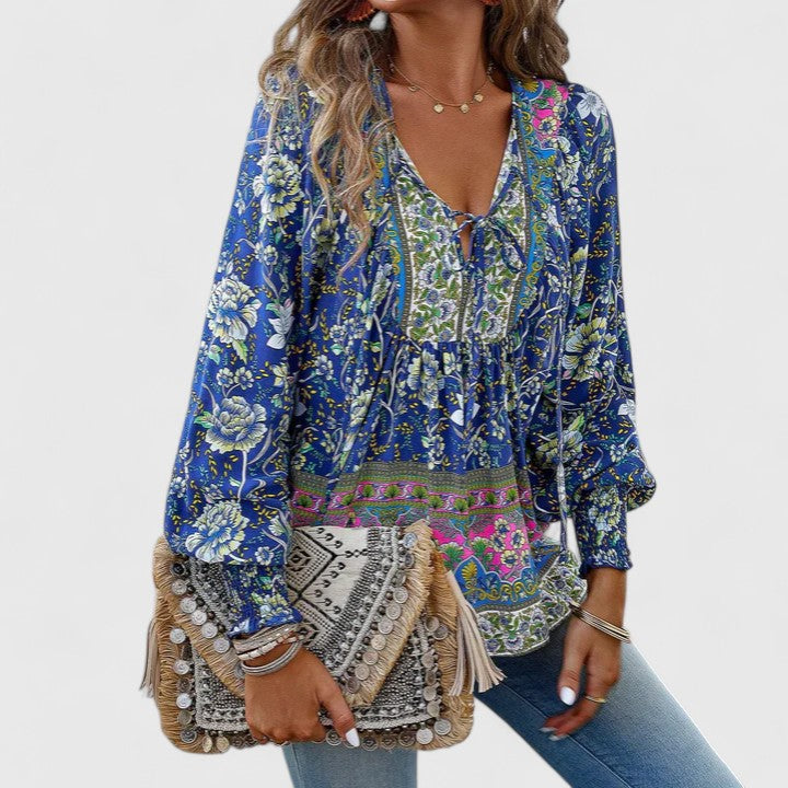 Blue floral peasant blouse with V-neck tie, tiered bodice, long puff sleeves