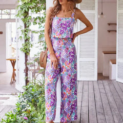 Purple floral wide-leg jumpsuit, sleeveless square neckline, thin straps, long wide legs