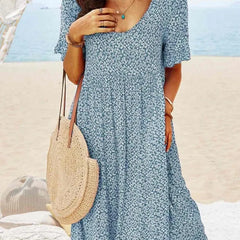 Blue floral babydoll dress with V-neck and short sleeves, knee-length