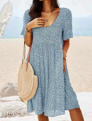 Blue floral babydoll dress with V-neck and short sleeves, knee-length