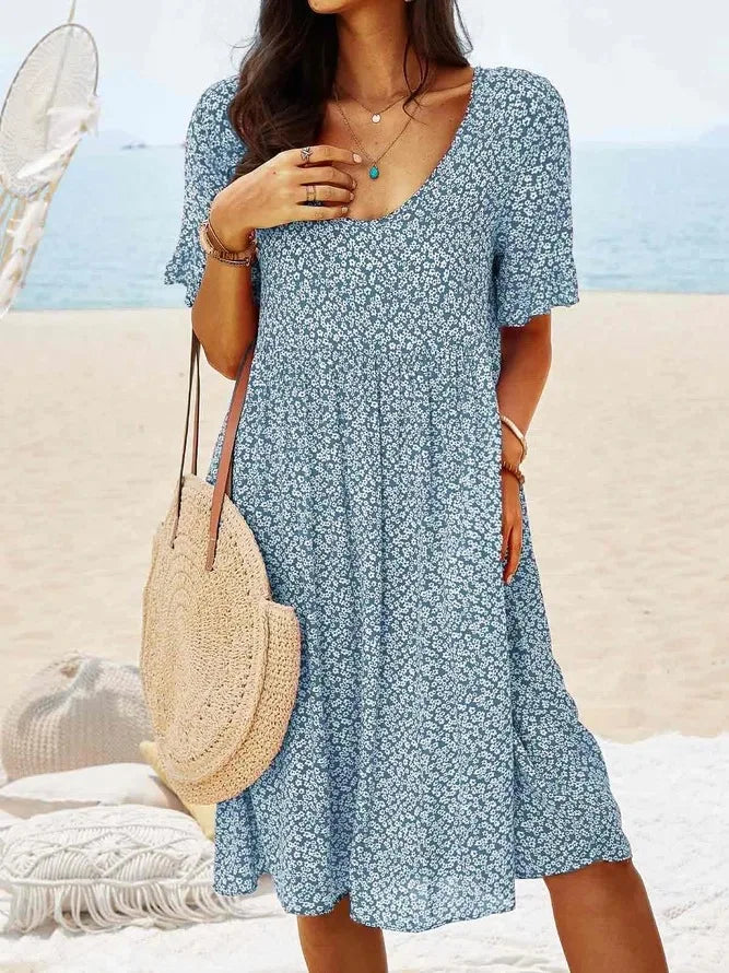 Blue floral babydoll dress with V-neck and short sleeves, knee-length