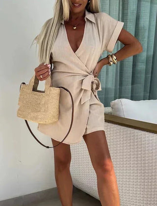 Beige belted playsuit with V-neck, short sleeves and wrap front