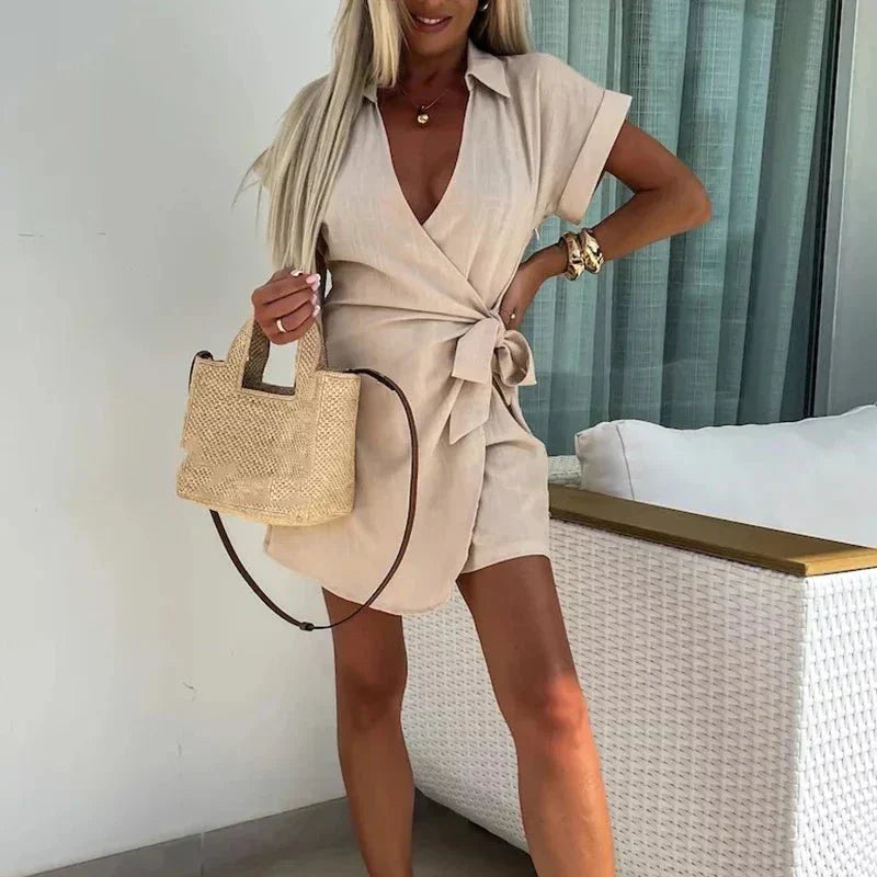 Beige belted playsuit with V-neck, short sleeves and wrap front