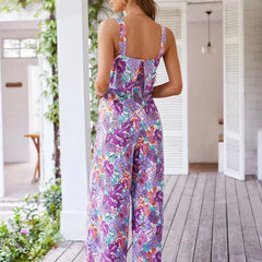 Purple floral wide-leg jumpsuit, back view, sleeveless square neckline, wide-leg pants