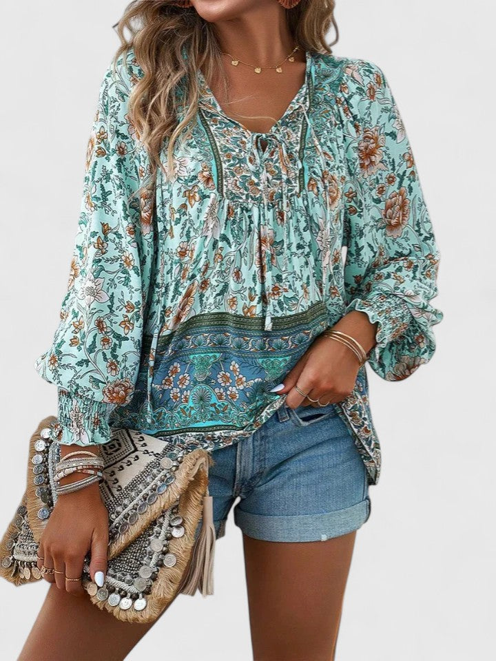 Teal floral peasant blouse with gathered neckline, dark embroidered border