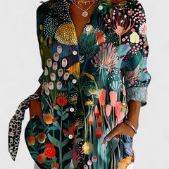 Dark floral print blouse with button-front, pointed collar, and long sleeves