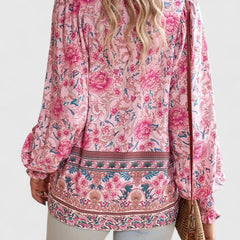 Pink floral peasant blouse back view with decorative border and long sleeves