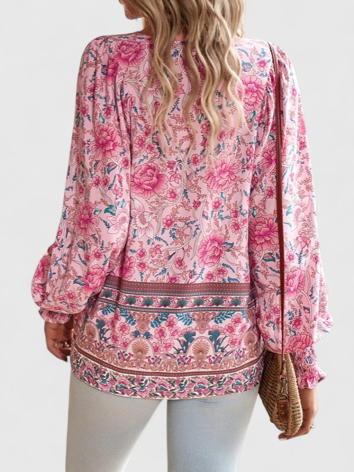 Pink floral peasant blouse back view with decorative border and long sleeves