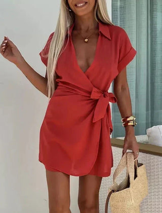 Red belted playsuit with V-neck and short sleeves, wrap-style front