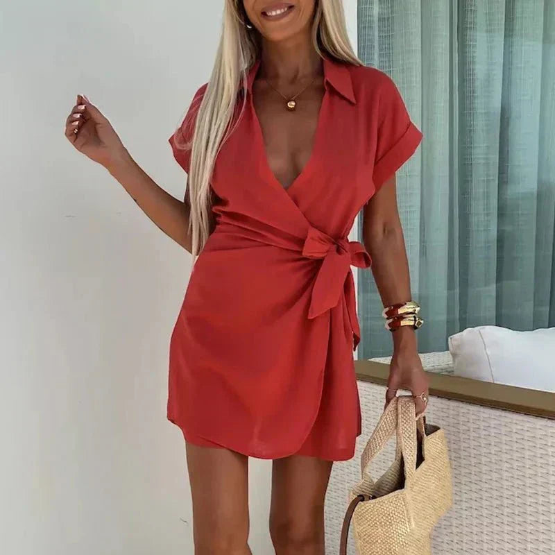 Red belted playsuit with V-neck and short sleeves, wrap-style front