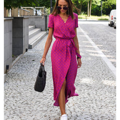 Magenta polka-dot wrap dress with short sleeves, V-neckline, and belted waist