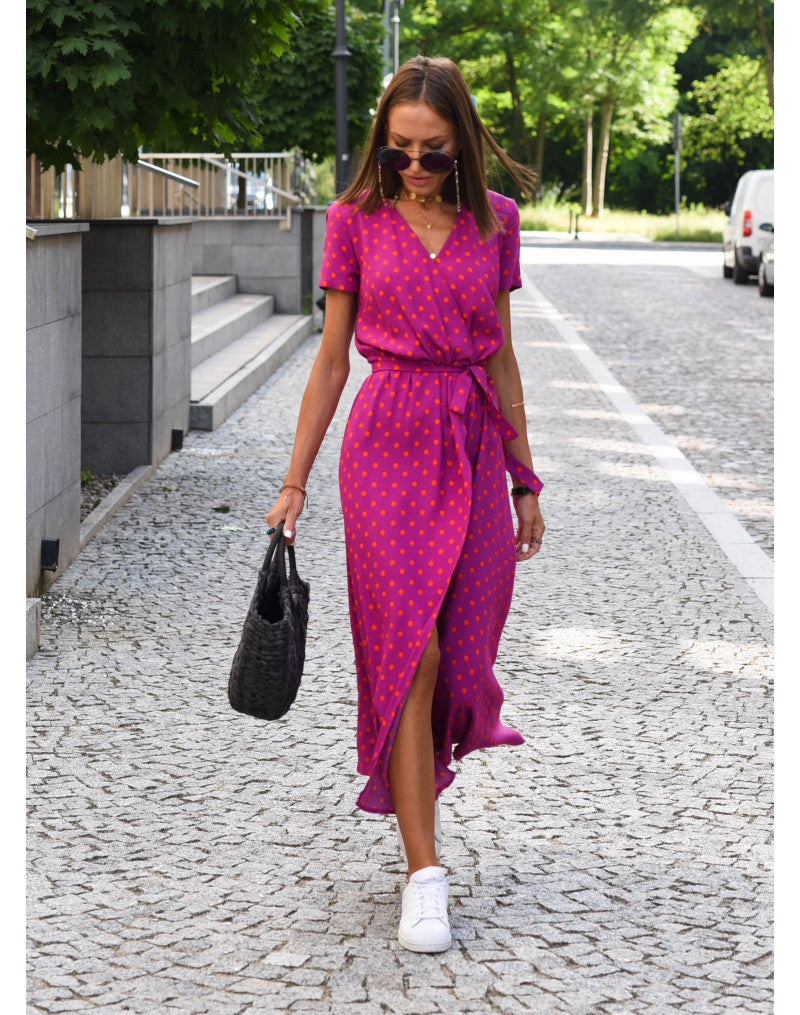 Magenta polka-dot wrap dress with short sleeves, V-neckline, and belted waist