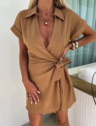 Brown belted playsuit with deep V neckline and short sleeves, wrap style