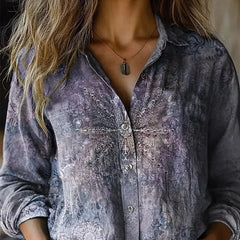 Slate blue patterned button-up blouse with long sleeves and front button placket