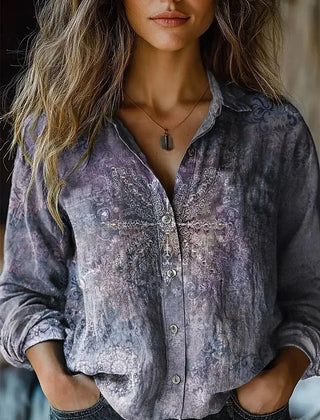 Slate blue patterned button-up blouse with long sleeves and front button placket
