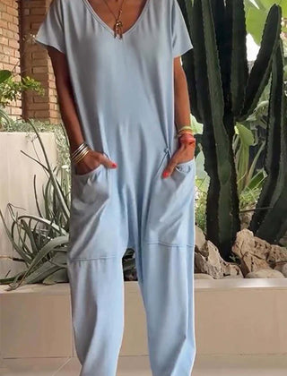 Light blue V-neck short-sleeve jumpsuit with patch pockets and loose tapered legs
