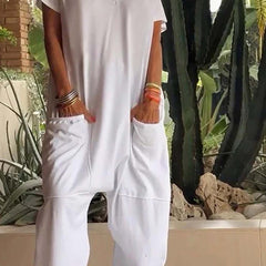 White V-neck short-sleeve jumpsuit with patch pockets and relaxed tapered legs