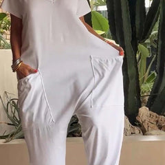 White V-neck short-sleeve jumpsuit with large front patch pocket and relaxed fit