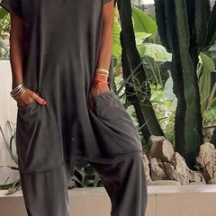 Charcoal V-neck short-sleeve jumpsuit with patch pockets and relaxed tapered legs