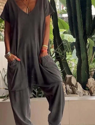 Charcoal V-neck short-sleeve jumpsuit with patch pockets and relaxed tapered legs