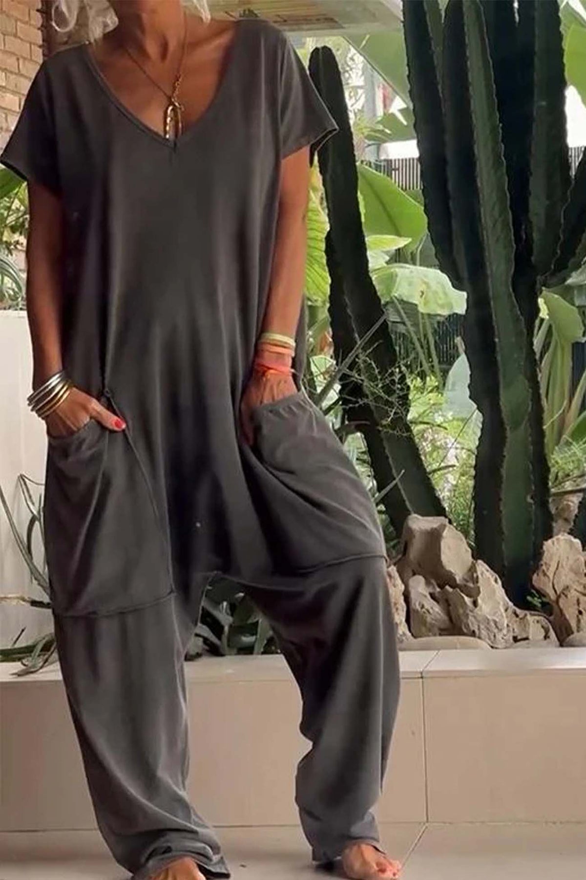 Charcoal V-neck short-sleeve jumpsuit with patch pockets and relaxed tapered legs