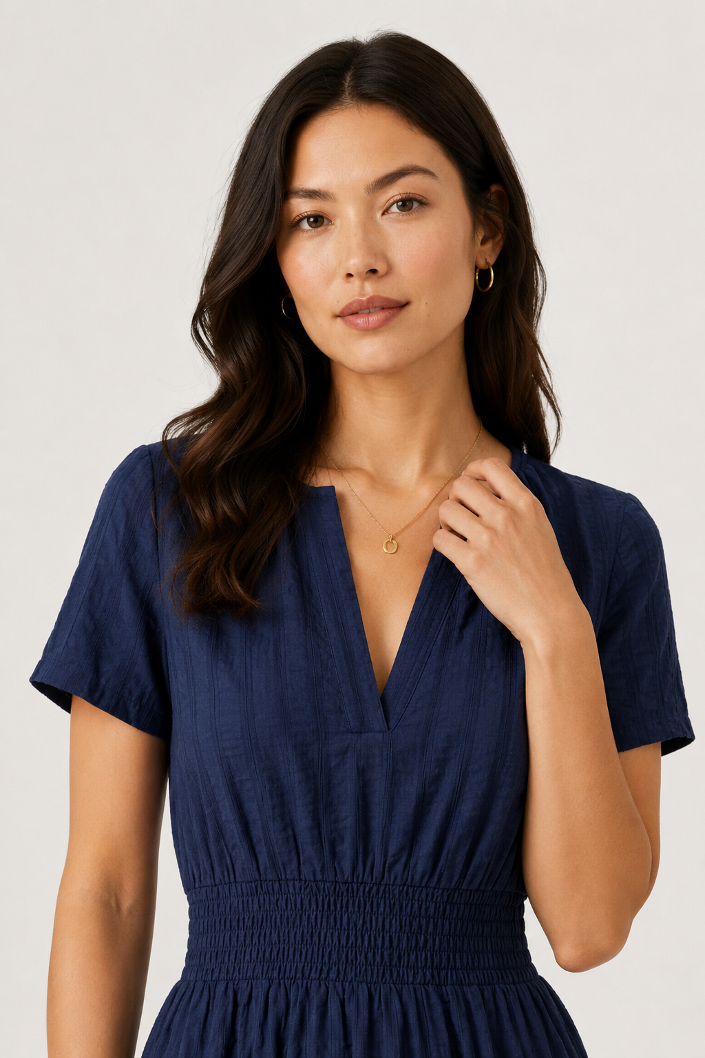 Blue V-neck tiered midi dress with short sleeves and smocked waist