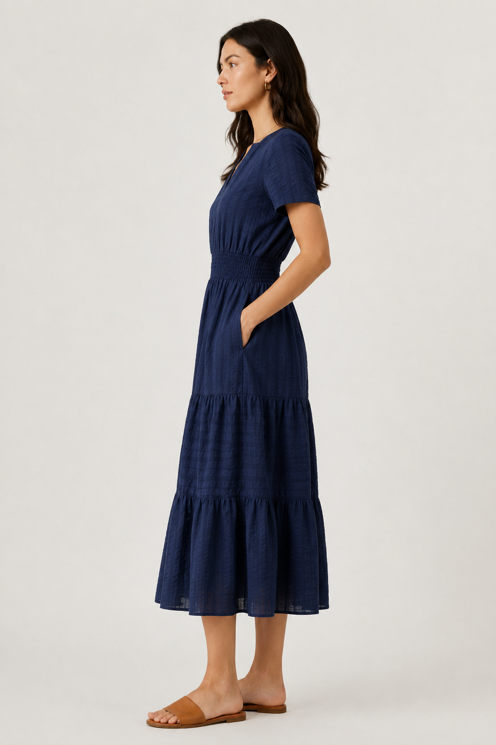 Blue tiered midi dress with short sleeves and V-neck, side view