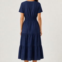 Blue tiered midi dress, back view with short sleeves and gathered waist