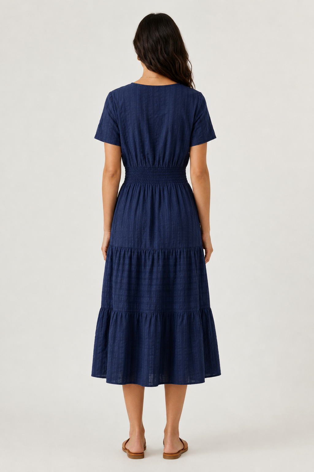 Blue tiered midi dress, back view with short sleeves and gathered waist