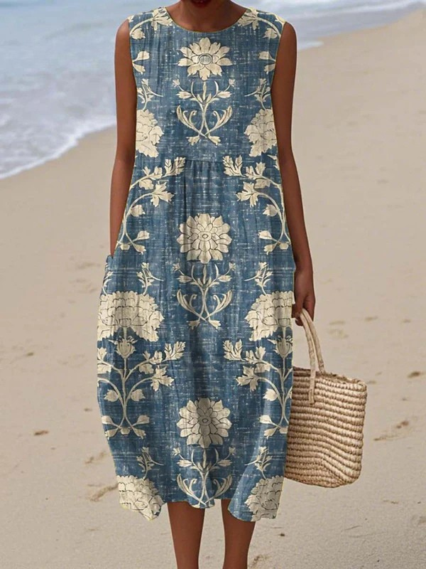 Sleeveless boho midi dress with blue floral print, tiered skirt and round neckline